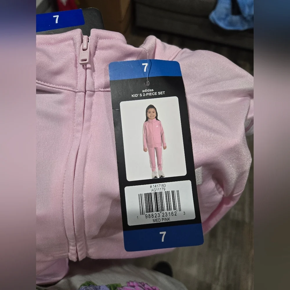 Adidas Toddler Girls 2-pc. Track Suit in light pink‎ with white stripes.